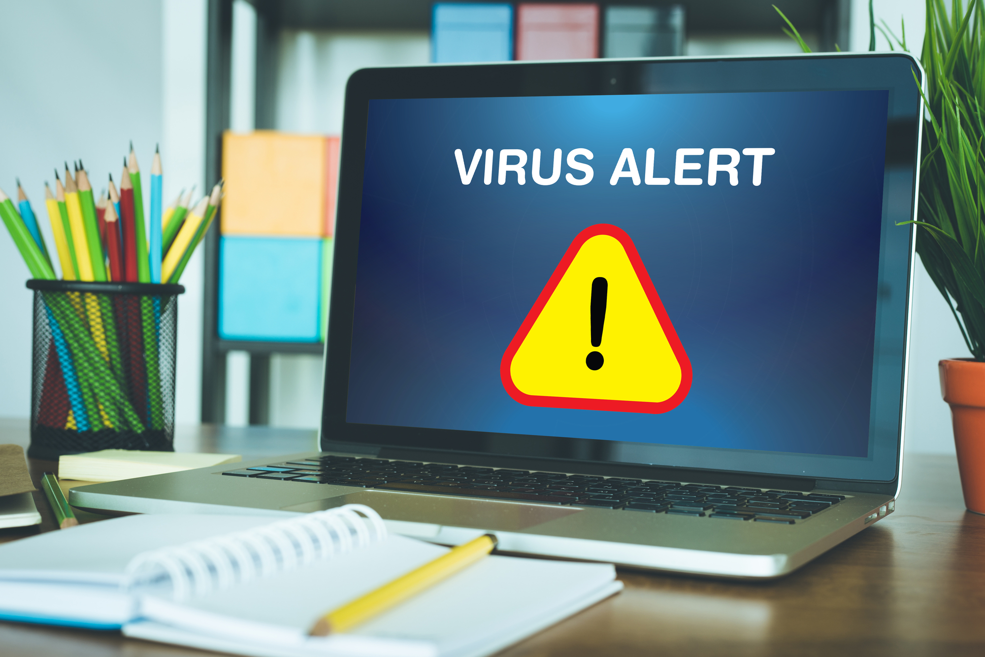 Computer screen showing "Virus Alert" and an excalamtion mark icon